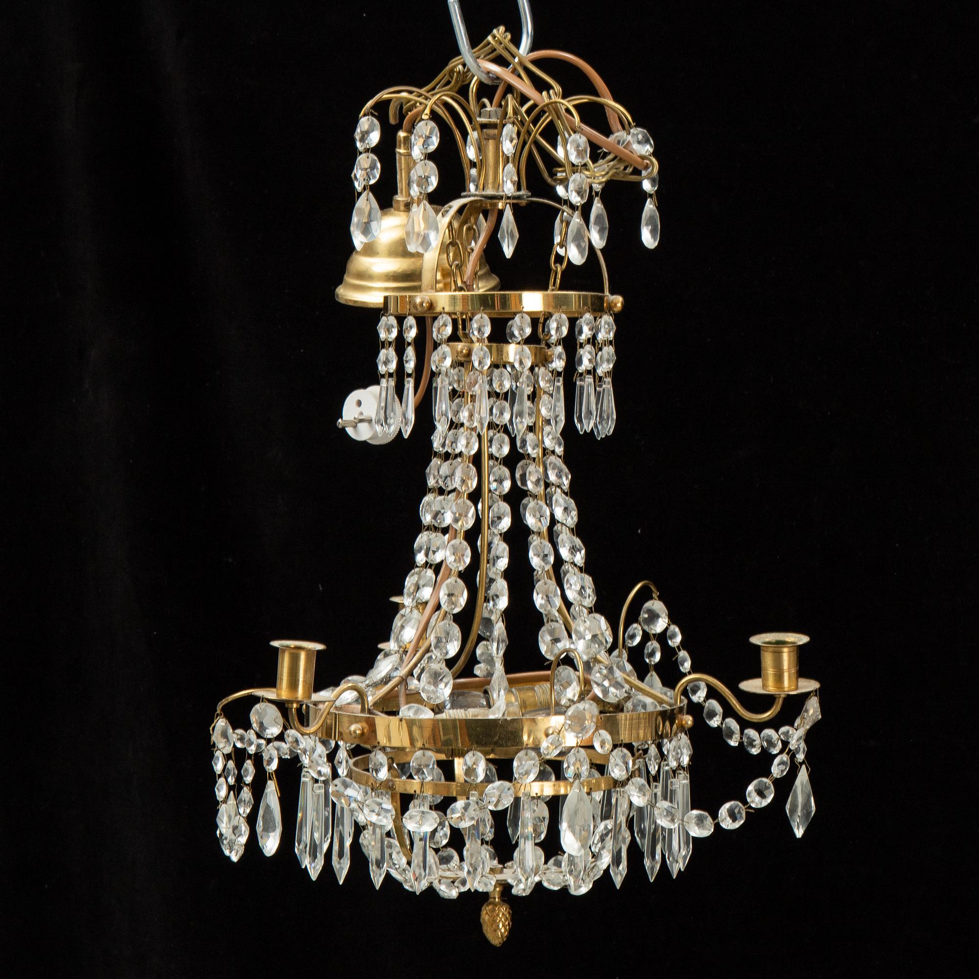 A small Swedish 20th century empire style chandelier for three candles.