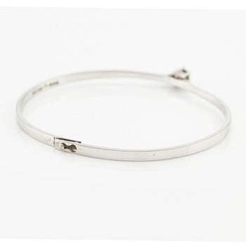 Bangle 18K white gold with a round brilliant-cut diamond.