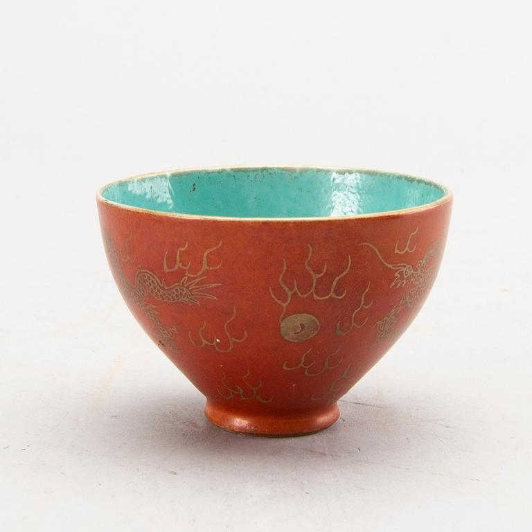 A set of four bronze giurines, a wooden bowl, two stands and one porcelain cup with stand, 20th century.