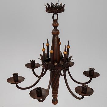 An iron and oak chandelier, 20th Century.