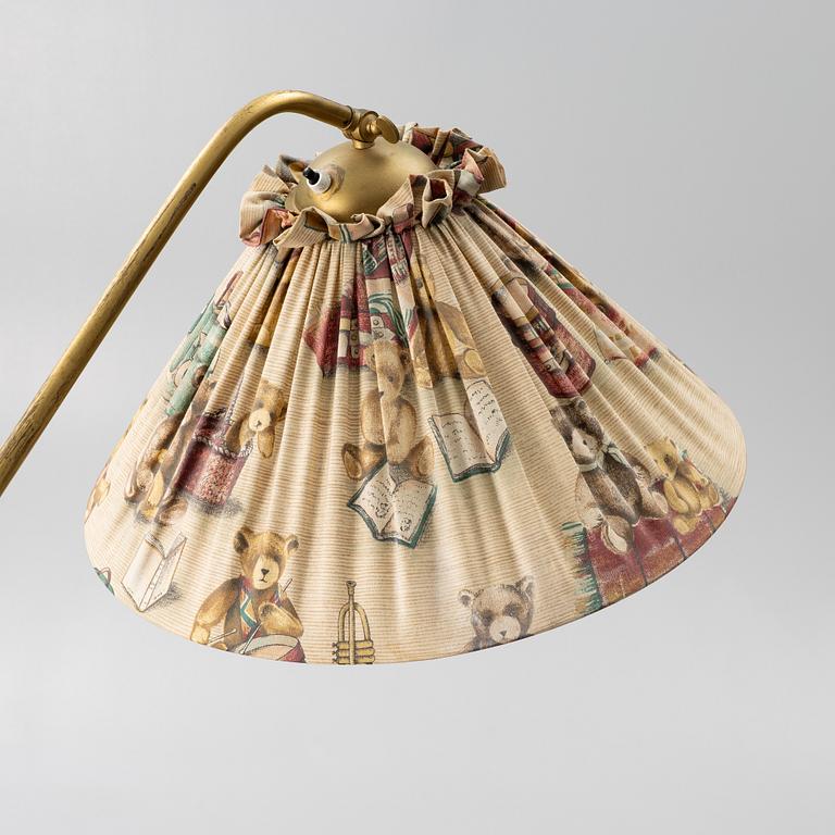 A 1940s Swedish Modern floor lamp.