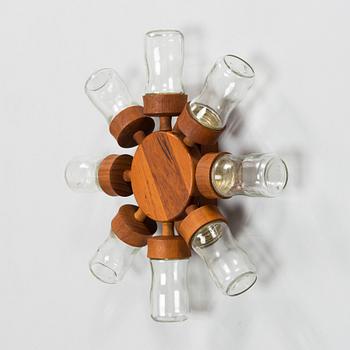 A Danish 1960s wall mounted spice rack in teak and glass from Digsmed.