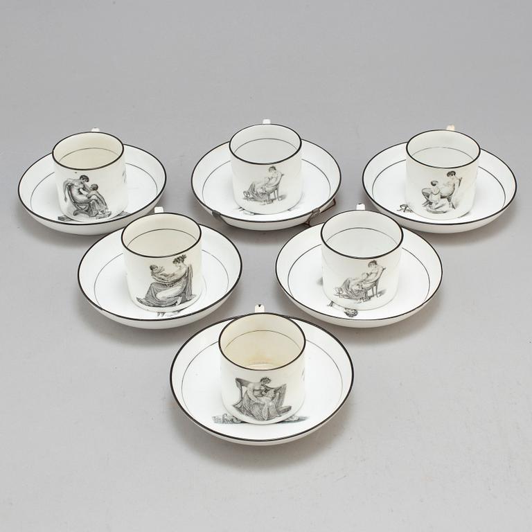 Six soft paste cups with saucers, early 19th century.