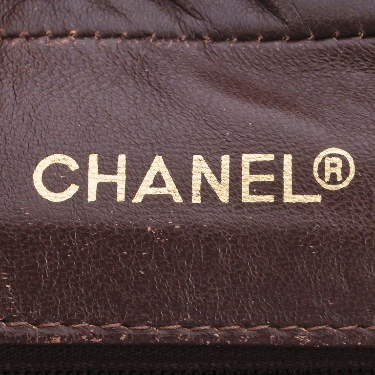 CHANEL, a brown crocodile shoulderbag from the 1980s.