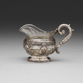 A Russian 19th century glass and silver cream-jug, unidentified makers mark, St. Petersburg 1834.