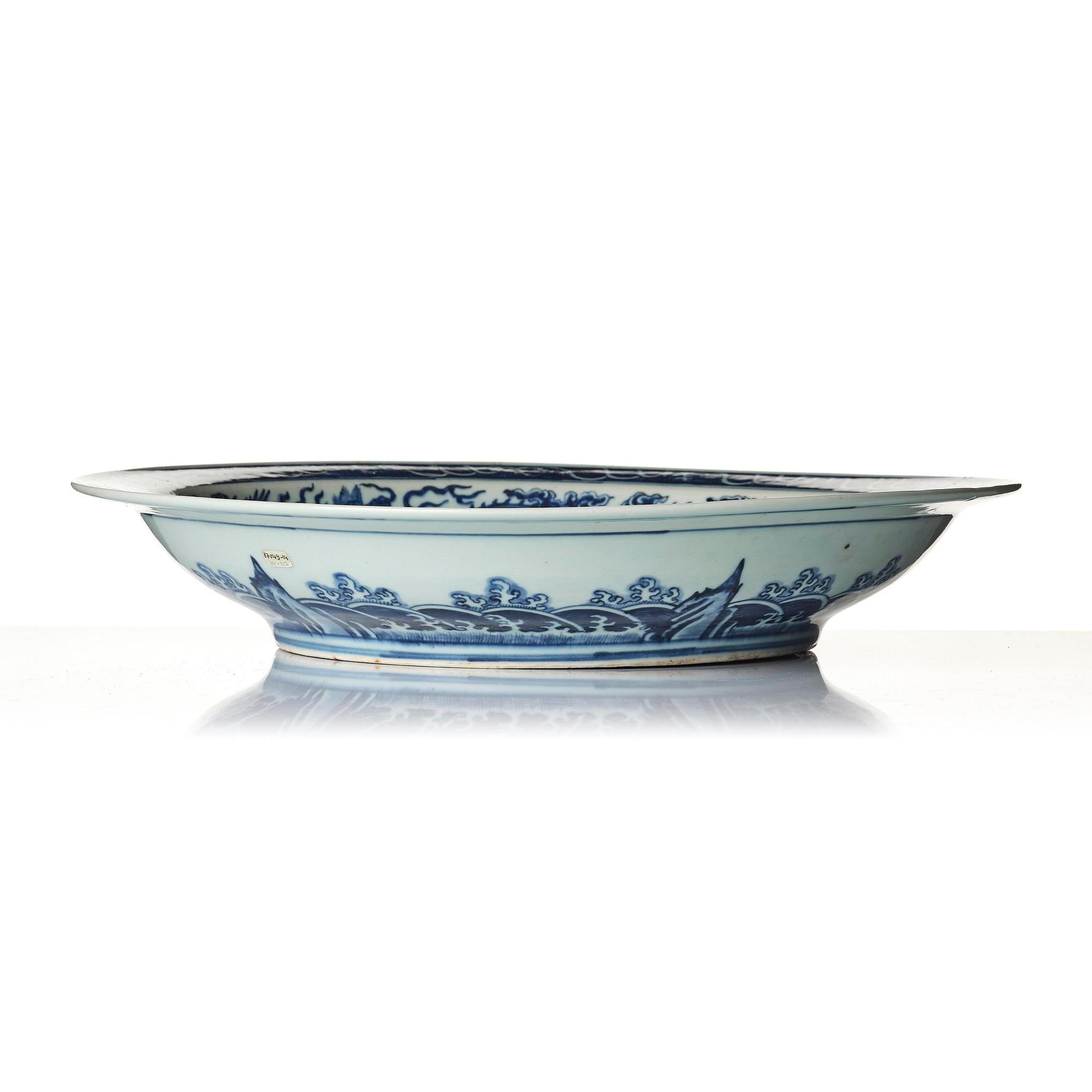A large blue and white 'dragon' charger, late Qing dynasty/Republic with an apocryphal Yongzheng mark.