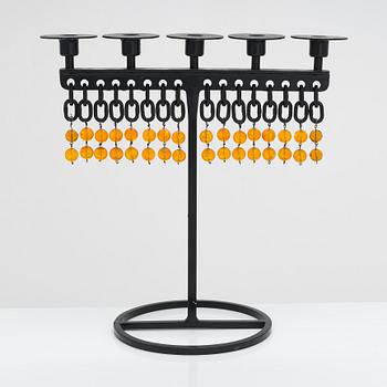 A wrought iron candlestick by Kaija Aarikka, Finland.