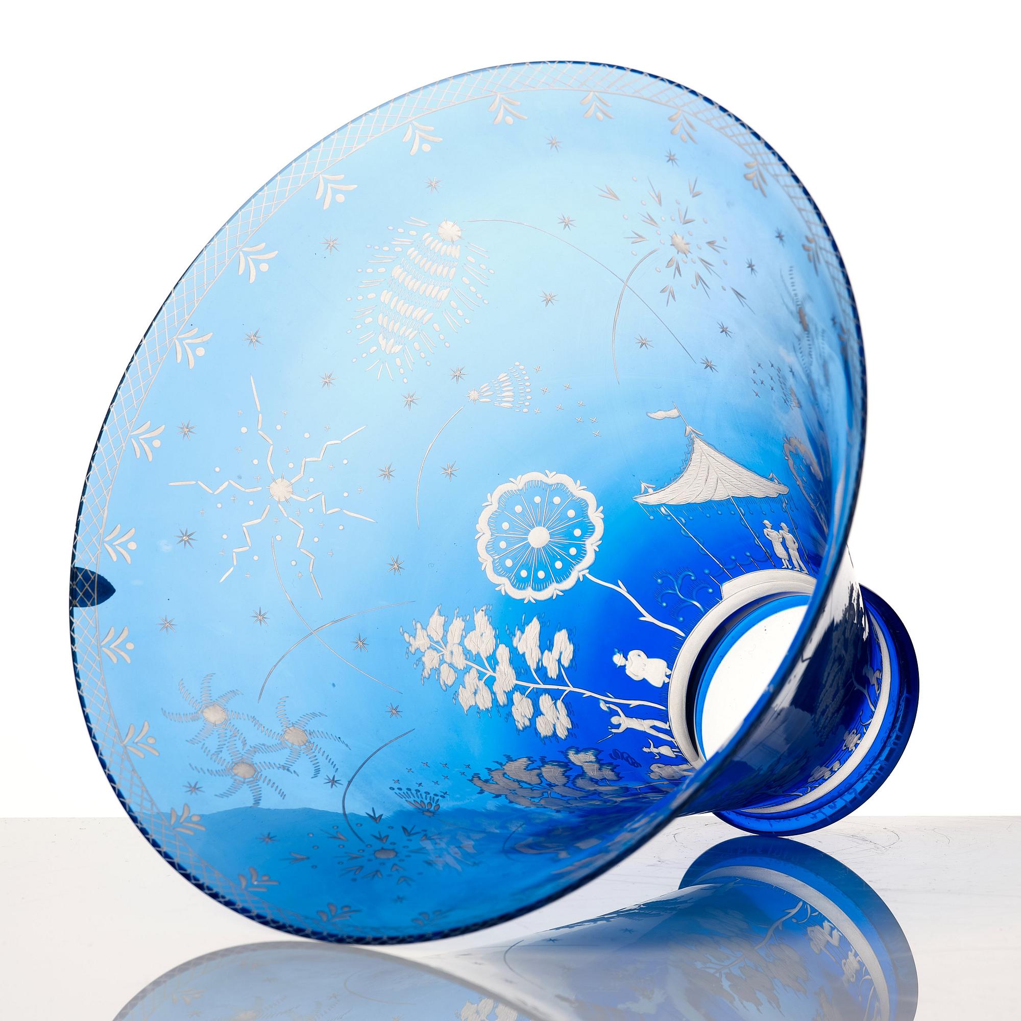 Edward Hald, an engraved blue glass "Fyrverkeriskålen" glass bowl, Orrefors 1957, engraved by Karl Rössler.