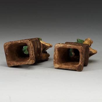 A pair of brown, green and yellow glazed joss stick holders, Qing dynasty (1644-1912).