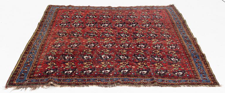 An oriental rug, semi antique, probably Baluch, c. 210 x 170 cm.