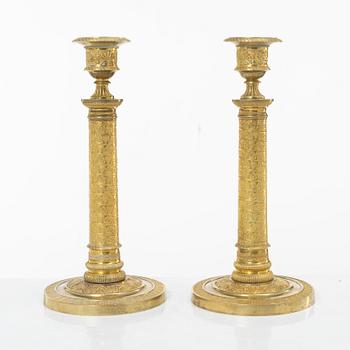 A pair of Empire candlesticks, France, early 19th Century.