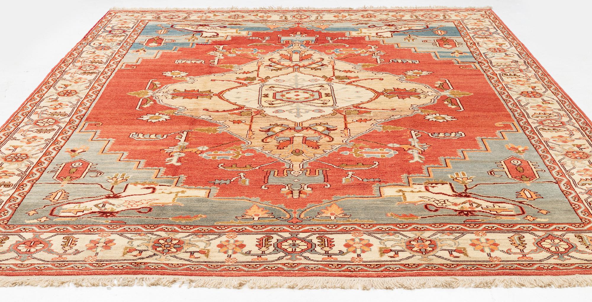 A Heriz design carpet 393 x 293 cm.