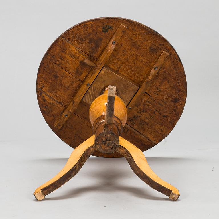 A tilt top table from 19th Century.