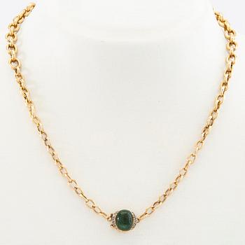 Necklace 18K gold with a cabochon-cut green tourmaline and rose-cut diamonds.