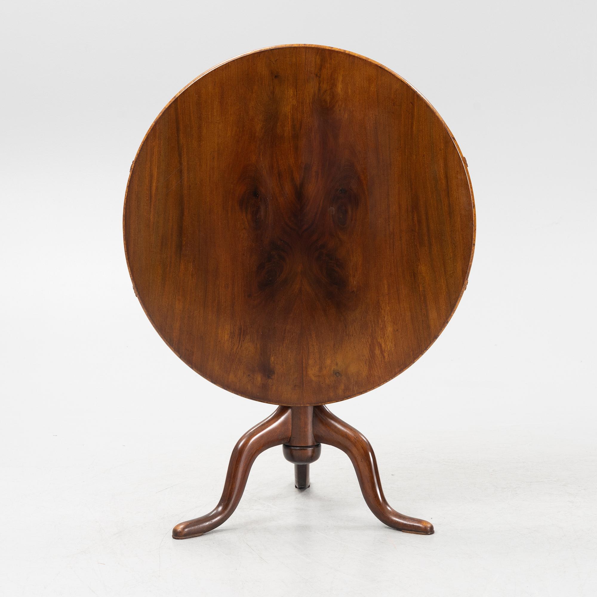 A tilt-top table.