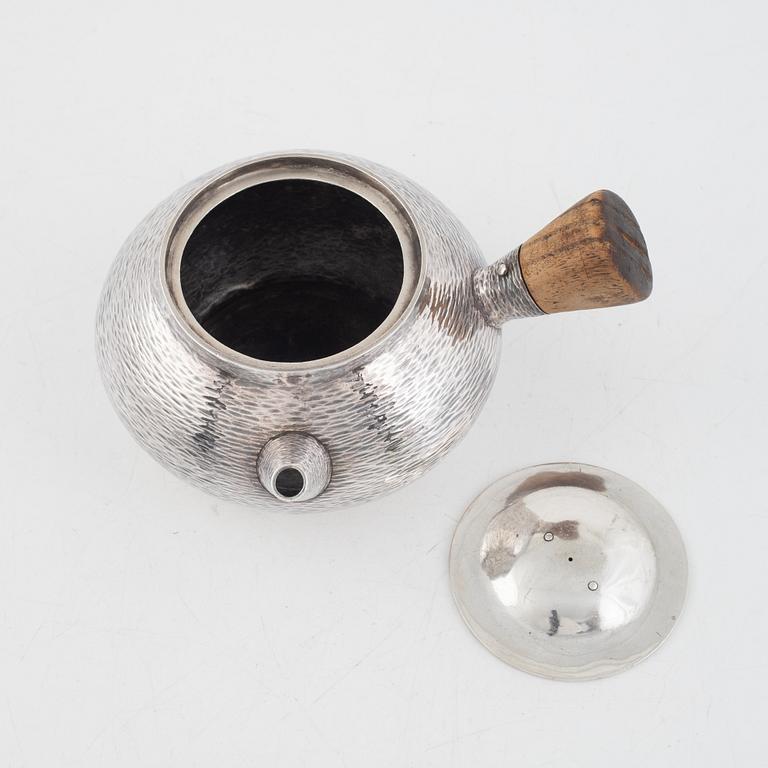 A silver teapot, first part of the 20th century.