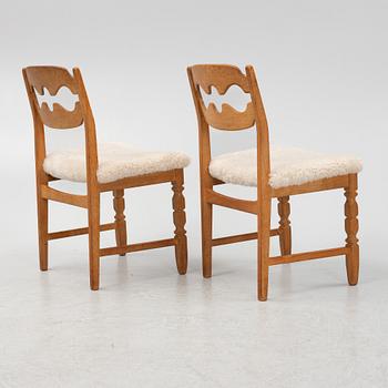 Henning Kjærnulf, a set of six oak 'razorblade' chairs, with new sheepskin upholstery, for EGK, 1960s.