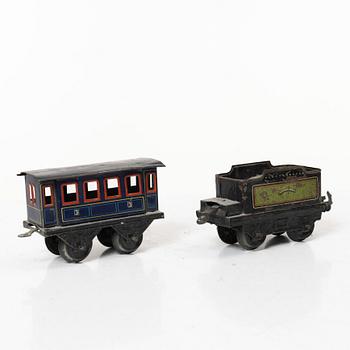 Model train with track and station building, 13 pieces, Germany, 1920s.