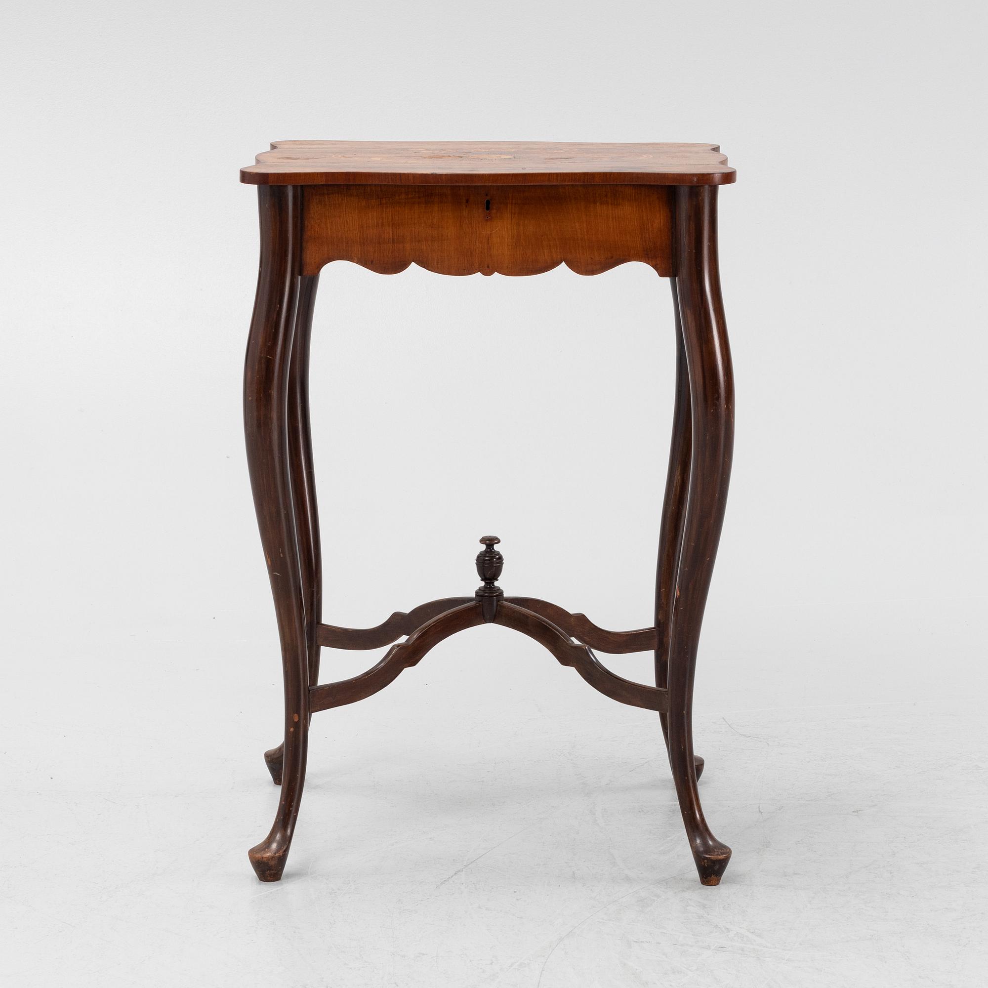 A Rococo style rosewood-veneered and mahogany sewing table, early 20th century.