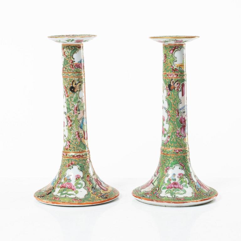 A pair of famille rose Canton candle sticks, Qing dynasty, 19th century.