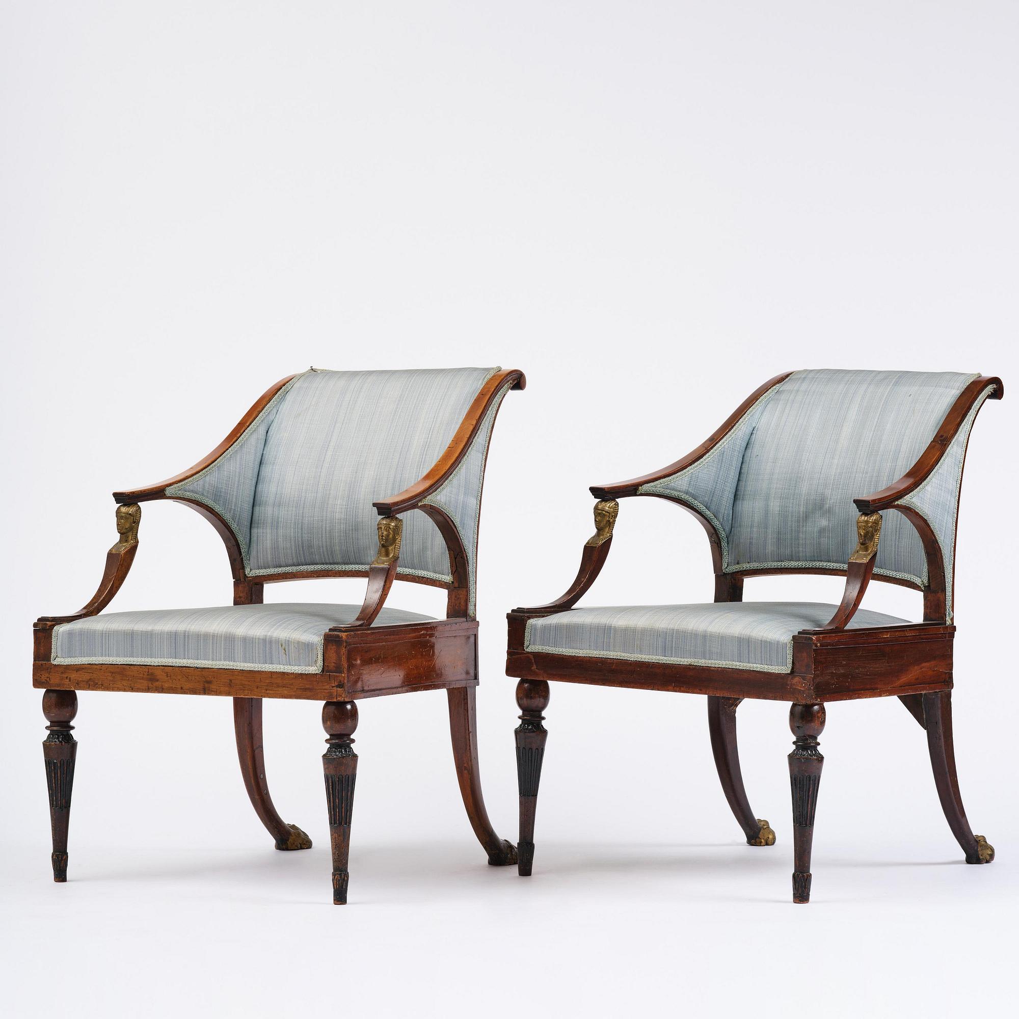 A pair of late Gustavian mahogny armchairs.