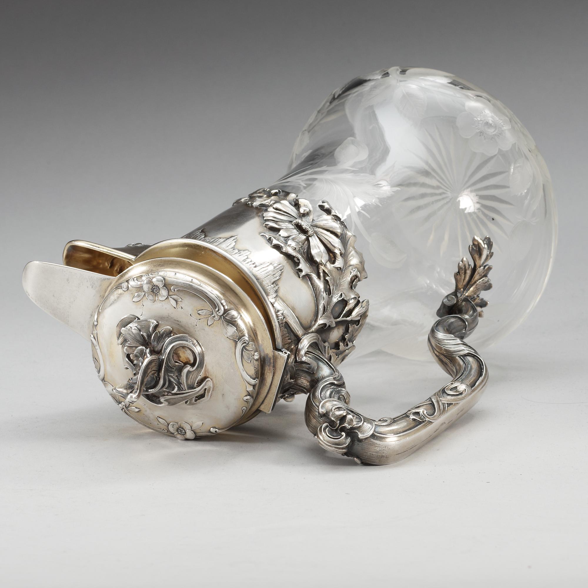 A Russian 20th century glass and parcel- gilt jug.