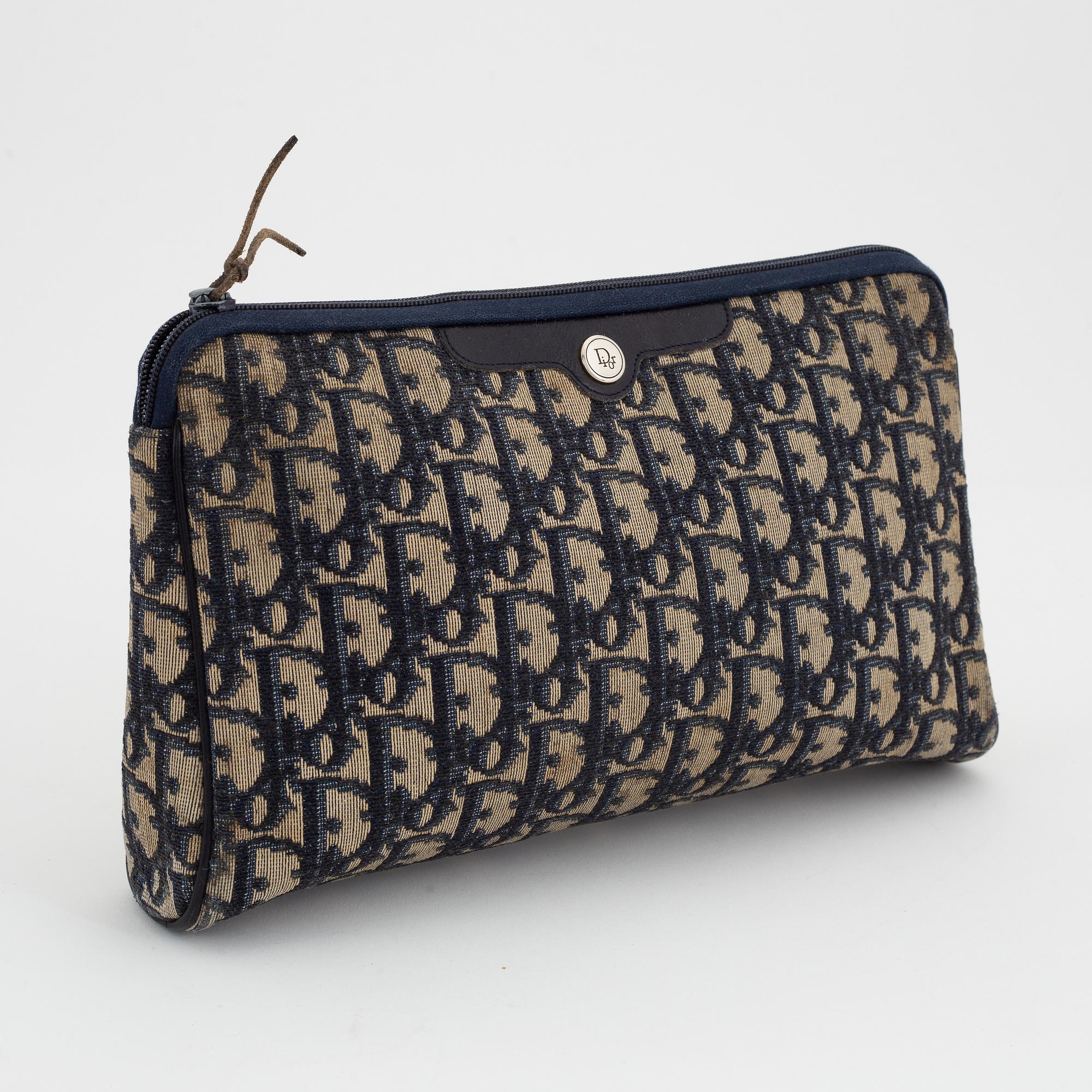 Christian Dior, a canvas handbag, toilet bag and key holder.