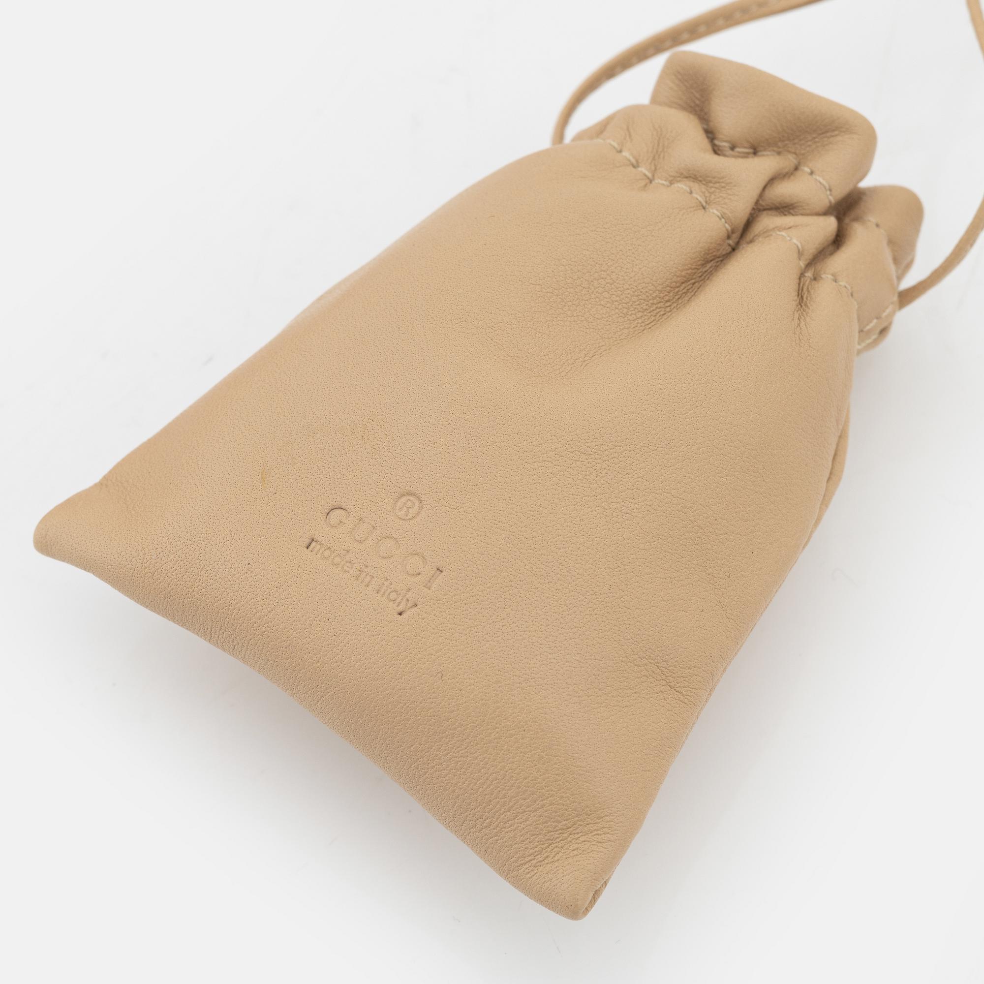 Gucci, a par of collarbags in pink and beige leather.
