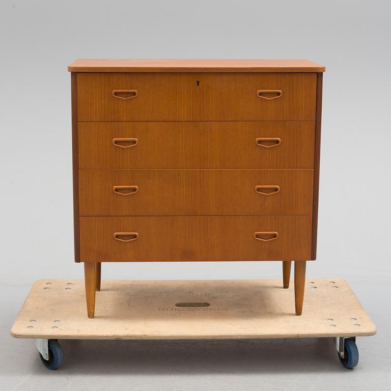 A second half of the 20th century teak veneered chest of four drawers.