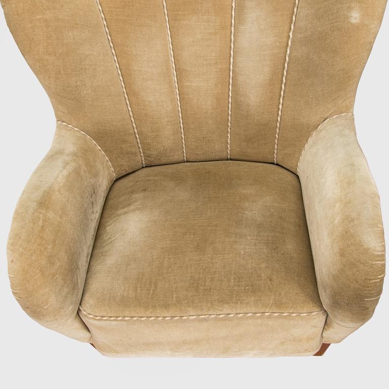 A pair of mid-20th century armchairs.