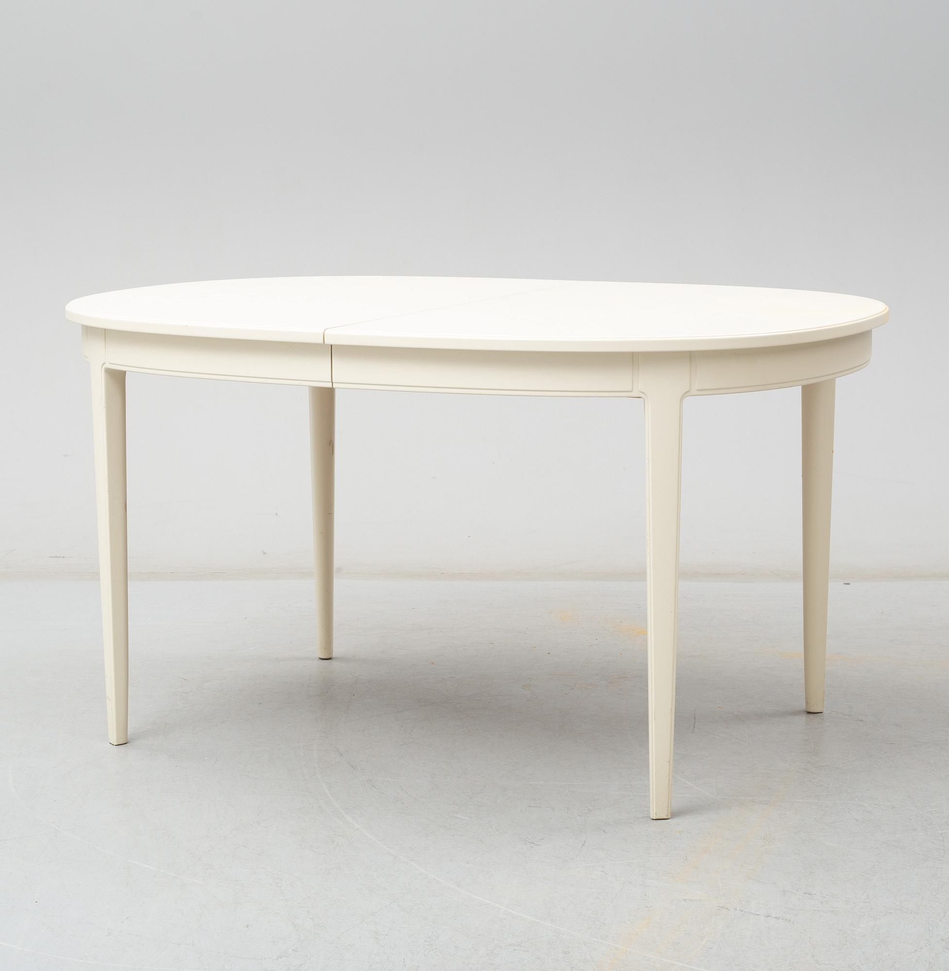 A dining table with four chairrs and two armchairs by Carl Malmsten from Åfors.