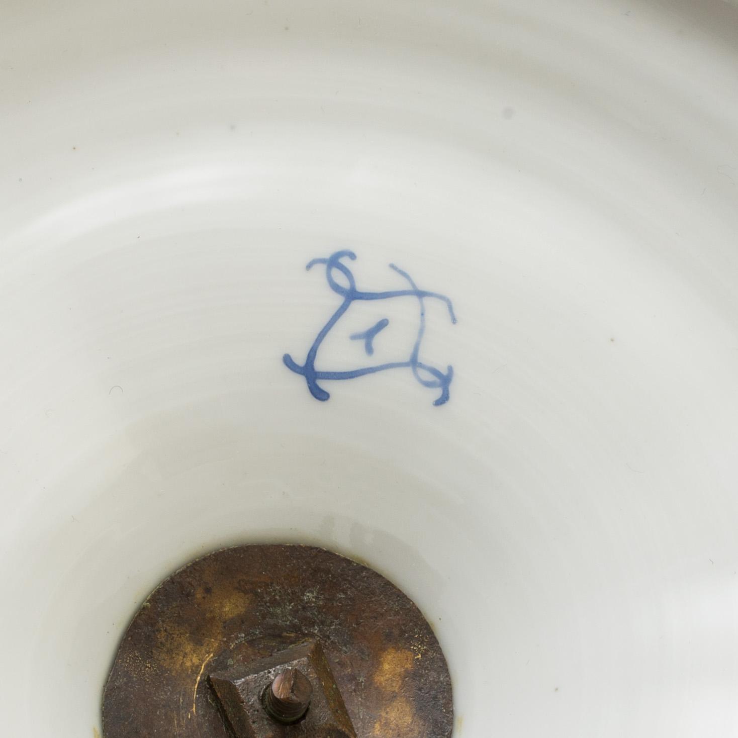 A pair of French 19th century porcelaine 
lidded vases with Sèvres style mark.
