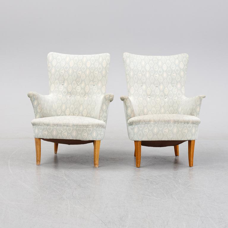 A pair of easy chairs by Carl Malmsten second half of the 20th Century.