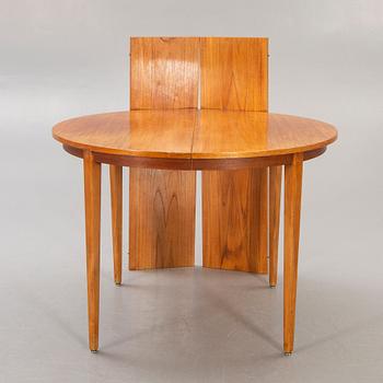 A 1960s teak dining table.