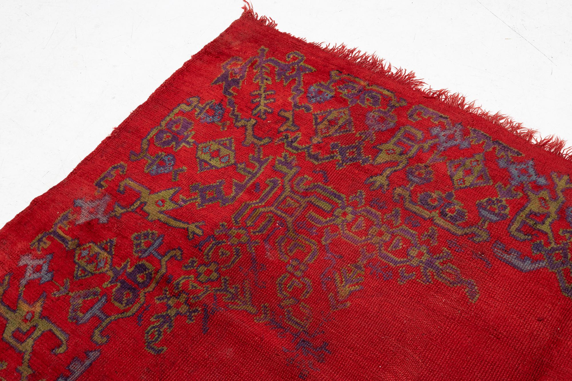 An antique Ushak carpet, West Anatolia, approx. 327 x 250.