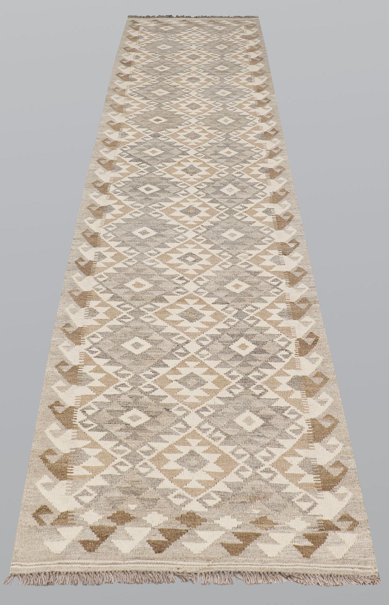A runner, kilim, ca 387 x 79 cm.