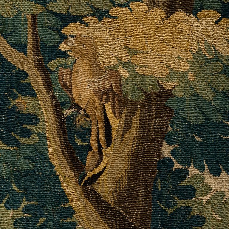 A TAPESTRY FRAGMENT, tapestry weave, ca 215,5 x 48 cm, Flanders around 1700.