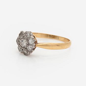 An 18K gold ring with old-cut diamonds.