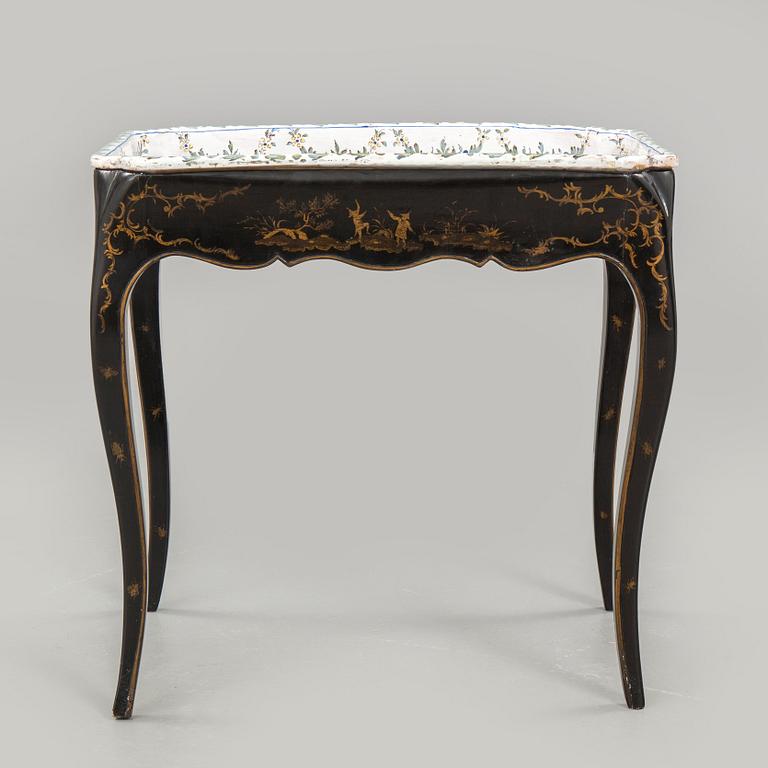 A Swedish Rococo faience tea table, Marieberg 1770.