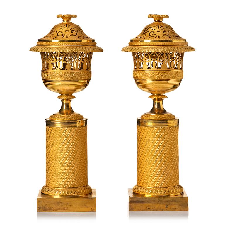 A pair of French Empire candlesticks, early 19th century.