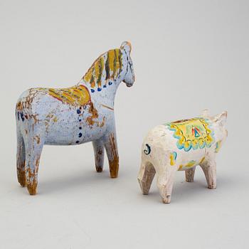 A painted folk art dala horse and dala pig, first half of the 20th century.