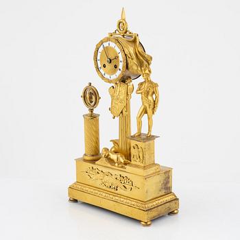 A French Empire ormolu figural mantel clock, early 19th century.