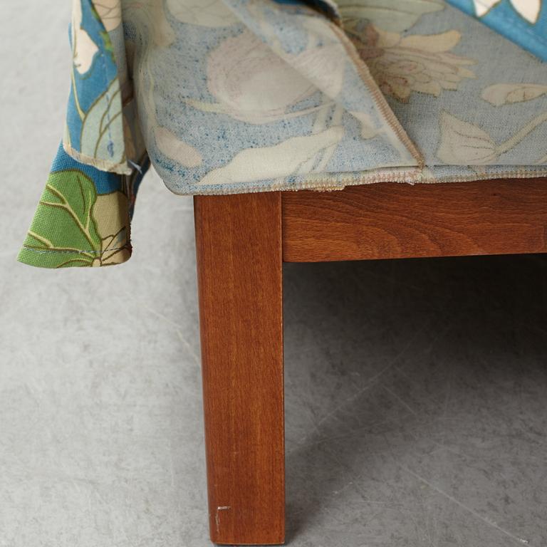 A Swedish armchair and stool, Norell Möbel, late 20th century.