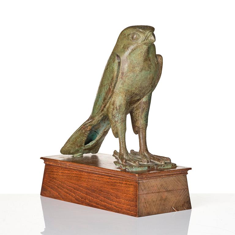 A fine and large Egyptian bronze figure of Horus the falcon, presumably late period Dynasty XXVI, (663-525 B.C.).