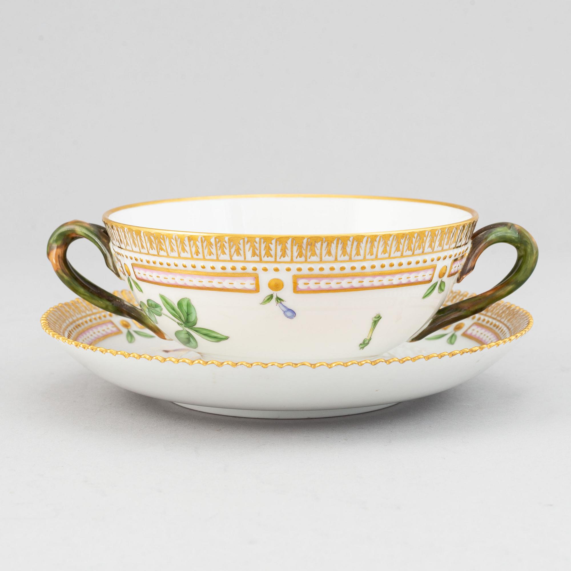 Royal Copenhagen, A 'Flora Danica' porcelain soup cup with saucer.