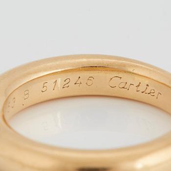 Cartier tre ringar "Ellipse" 18K guld med fasettslipad safir, smaragd och rubin.