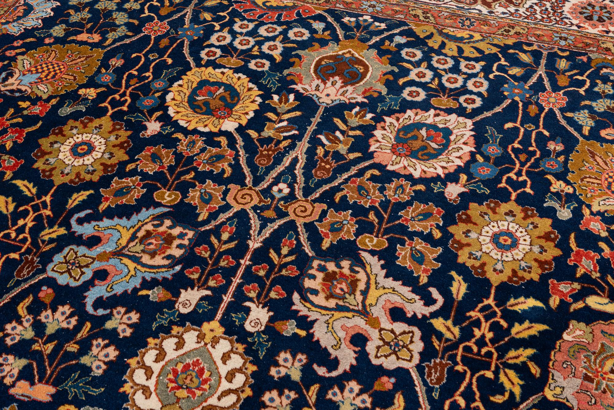 A semi-antique Tabriz carpet, c. 395 x 295 cm.