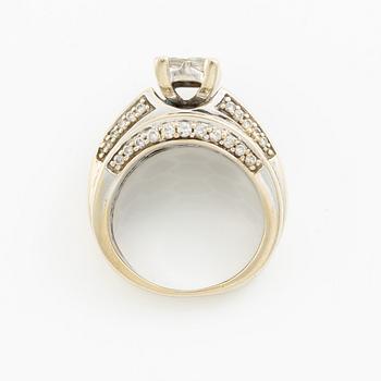 Ring, 14K gold with princess, baguette, and round brilliant-cut diamonds.