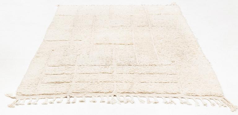 A Moroccan carpet, circa 308 x 181 cm.