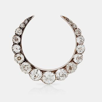 531. A Victorian crescent brooch set with old-cut diamonds, total carat weight circa 3.95 cts.